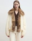 Model wearing Fireladyfur Day and Night Rider off-white detachable fox fur collar down jacket