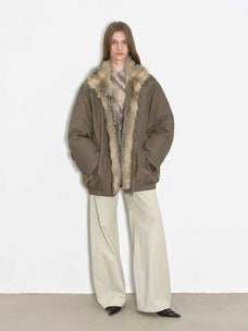 Model wearing Fireladyfur Travel Notes sand green warm winter down jacket with fluffy fox fur collar