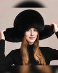 Women's fox fur trapper hat with earmuffs in Black – styled on model | Firelady Fur