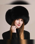 Women's fox fur trapper hat with earmuffs in Black – styled on model | Firelady Fur
