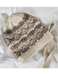 Women's khaki jacquard knitted winter hat in product packaging
