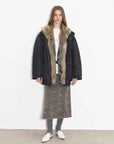 Full-body model view of Fireladyfur Travel Notes black down jacket with fluffy fox fur collar