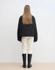Back view of Fireladyfur Day and Night Rider black down jacket showing relaxed parka silhouette