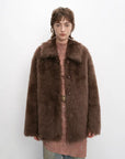 Woman wearing the Autumn Exclusive cocoa brown Toscana shearling coat, front view
