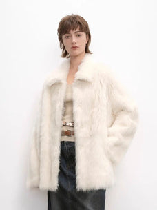 Woman wearing the Autumn Exclusive off-white Toscana shearling coat, front view