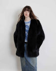 Model wearing Black Sugar Black Extended fox fur cardigan, front view