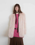 Model wearing Black Sugar Pink Extended fox fur cardigan, front view