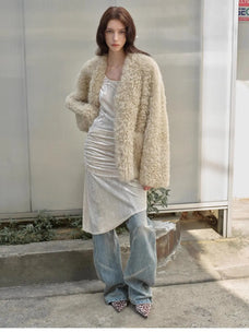 Model styling the Castle Dusk natural ivory V-neck Toscana shearling coat, full-length view