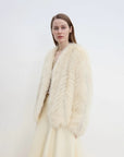 Model styling Champagne Light Yellow fox fur coat, three-quarter view