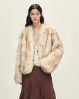 Model wearing Chic Sister Apricot Brown V-neck fox fur coat, front view