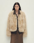 Model wearing Chic Sister Haze Yellow standing-collar fox fur coat, front view