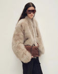 Chic Sister Hazel standing-collar fox fur coat, three-quarter model view
