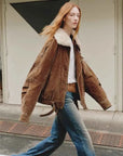 Model walking in Fireladyfur City Travel SUN GOLD BROWN fox fur down parka