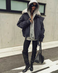 Model wearing Fireladyfur City Travel Denim Blue hooded down parka with detachable fox fur collar