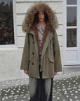 Fireladyfur Coastal Highway II shearling lined down parka walking side view