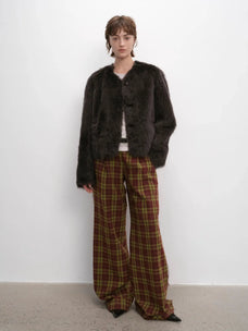Woman styling the Darcy Manor ink gray Toscana shearling coat, full-length view