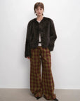 Woman styling the Darcy Manor ink gray Toscana shearling coat, full-length view