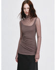 Pink brown double-layer transparent oblique collar fake two-piece knit top on EVA model side view