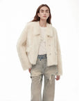 Woman wearing the Dream Walk milky white Toscana shearling short coat, front view