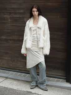 Woman styling the Dream Walk milky white Toscana shearling coat outdoors