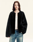 Black Merino shearling jacket styled with denim