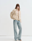 Model wearing Firelady Fur William Cream Frost rex rabbit fur knit jacket in Cream Apricot full length