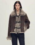 Woman wearing the Florence dark brown Merino shearling fox fur collar coat, front view