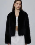 Model wearing Free Spirit Black short fox fur and leather coat