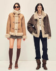 Models wearing Galaxy Gala tortoiseshell yellow and fog brown Merino shearling coats