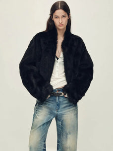 Woman wearing the Healing Eros black Toscana shearling coat, front view