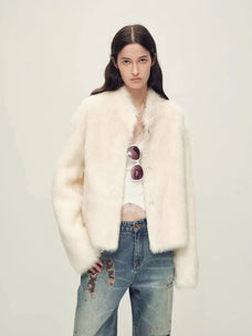 Woman wearing the Healing Eros white Toscana shearling coat, front styling view