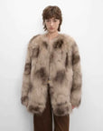Model wearing Heartbeat Caramel SagaFurs fox fur coat, front view