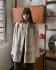 Hera Moonlight Silver Blue Cross mink coat indoor styling