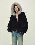 Model wearing Hokkaido Melody black short hooded Merino shearling jacket