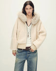 Model wearing Hokkaido Melody off-white short hooded Merino shearling jacket, close view