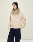 Model wearing Hokkaido Melody off-white short collar Merino shearling coat, full-length view