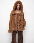 Model wearing the camel hooded Merino shearling jacket, view 2