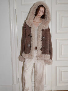 Model wearing the fog brown hooded Merino shearling jacket, view 2