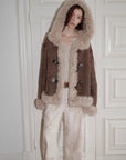 Model wearing the fog brown hooded Merino shearling jacket, view 2