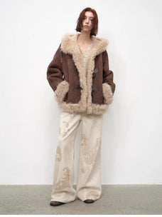 Model wearing the fog brown hooded Merino shearling jacket, view 4