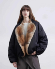 Model wearing Fireladyfur Hull Contract Classic Black sable muskrat fur down parka front view
