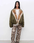 Full-length front view of Fireladyfur Hull Contract Army Green sable muskrat fur parka