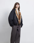 Side model view of Fireladyfur Hull Contract Classic Black fur collar down parka