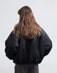Back model view of Fireladyfur Hull Contract Classic Black short down parka