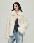 Woman wearing the Icelandic Bell Sound classic white Toscana coat, front view