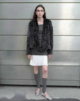 Inspiration Glimpse black and white rabbit fur coat street style view