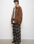 Woman styling the Jazz Party brown shearling jacket, three-quarter view