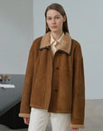 Model wearing the Knight's Contract yellowish brown Merino shearling coat