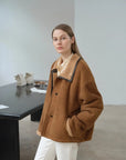 Yellowish brown shearling coat showing structured winter silhouette
