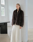 Long Nocturne black Saga fox fur coat styled on model